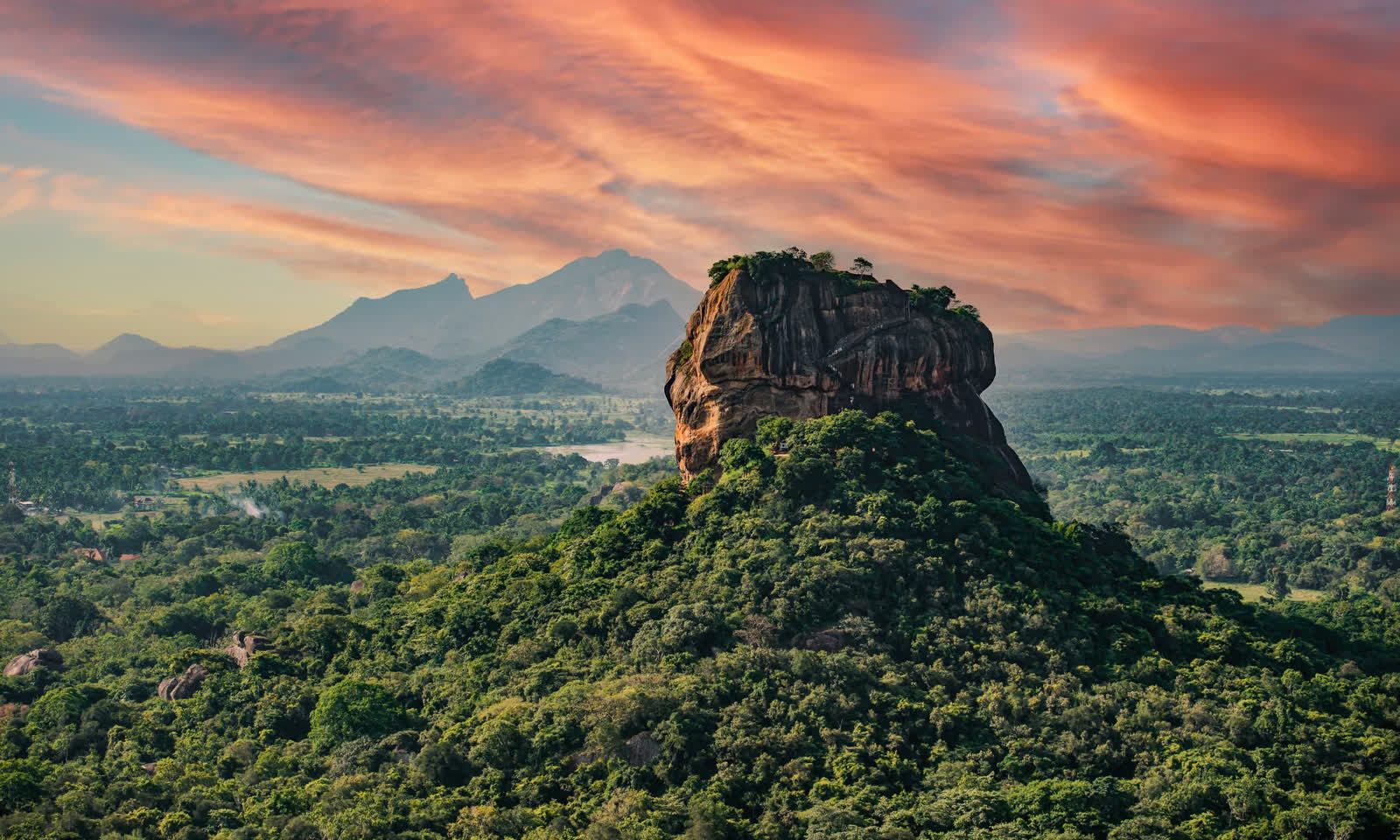 Sigiriya rock above the forest at sunset